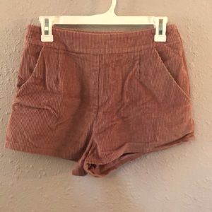 Pink corduroy shorts.